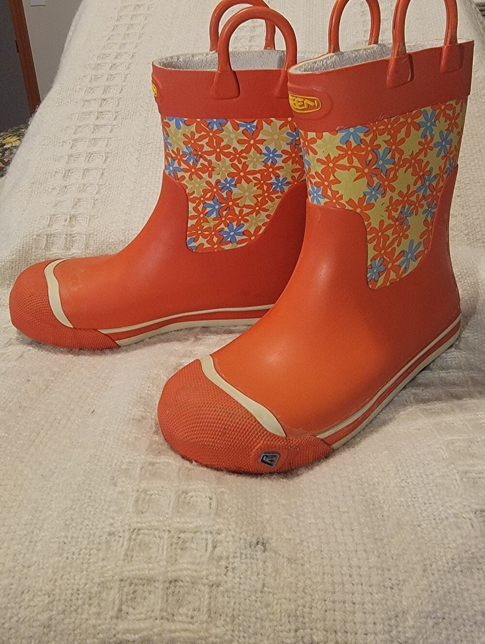 Keen orange and floral-patterned Coronado kids' waterproof rain boots